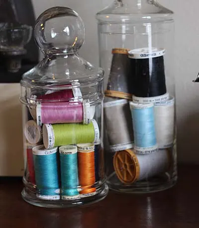 Jars With Colorful Quilting Thread.